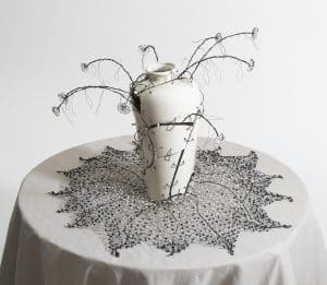 Intricate ceramic vase with wire and bead floral sculpture, showcasing Sue E Schneider Art’s mixed media creativity.