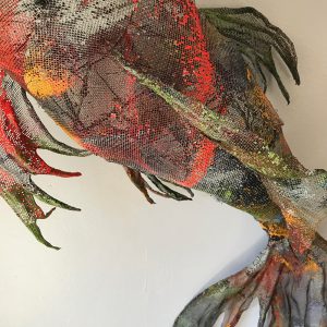 Sculpture of Koi fish created with painted and stitched aluminum screen